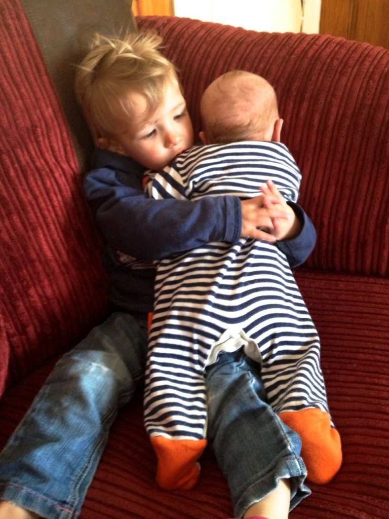 Cuddles with big sister