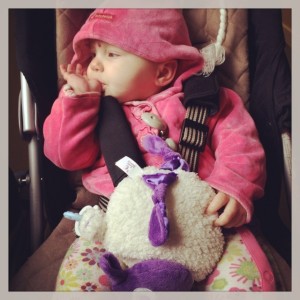 Lydia chilled out in her pushchair watching her big sister do all sorts of strange things! :-)