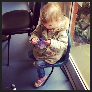 Waiting to be seen this morning, very happy with her "baby chair"
