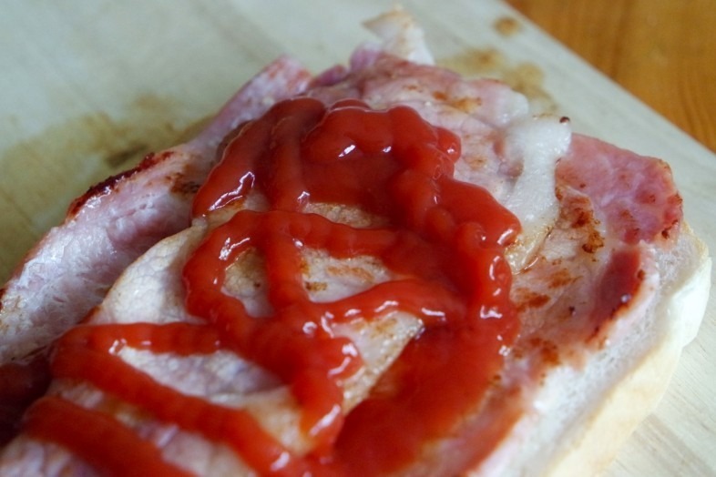 Bacon slathered with ketchup