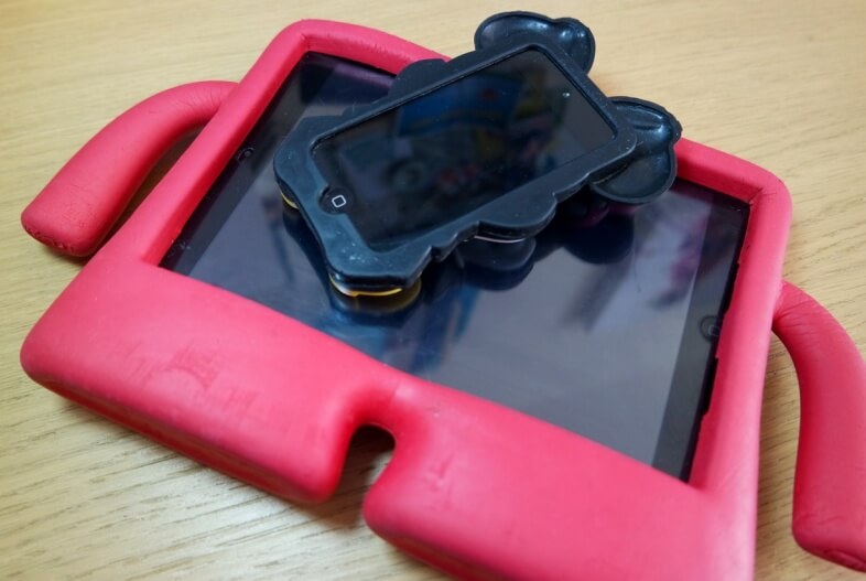 iPad Mini in Speck iGuy case and iPod Touch in Minnie Mouse case