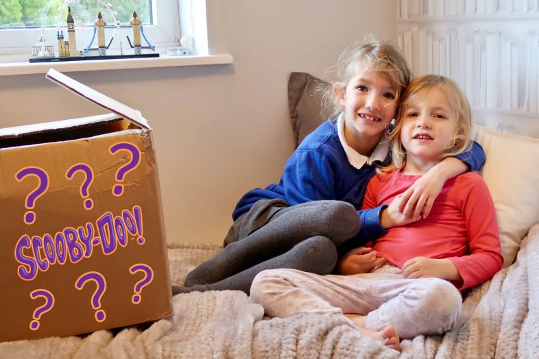 Georgie and Lydia with their surprise parcel