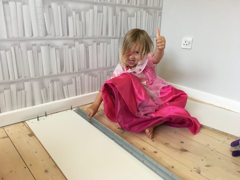 Lydia helping build furniture