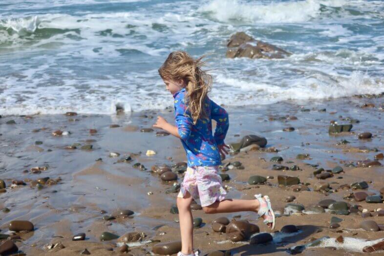 Lydia running along the beach