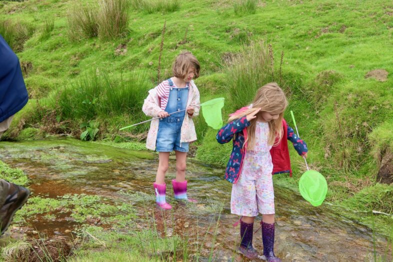Lydia and Georgie pond-dipping with their Grandparents